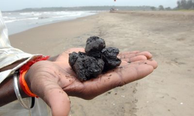 Tar balls litter Hua Si beach in Nakhon Si Thammarat