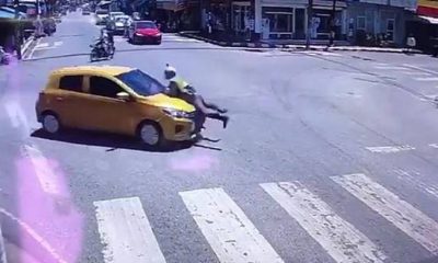 police man on mitsubishi hood