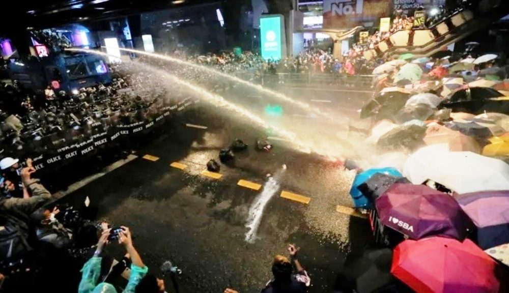 Riot Police Fire Water Canons at Anti-Government Protesters in Bangkok