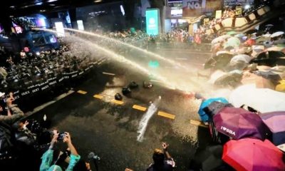 Riot Police Fire Water Canons at Anti-Government Protesters in Bangkok