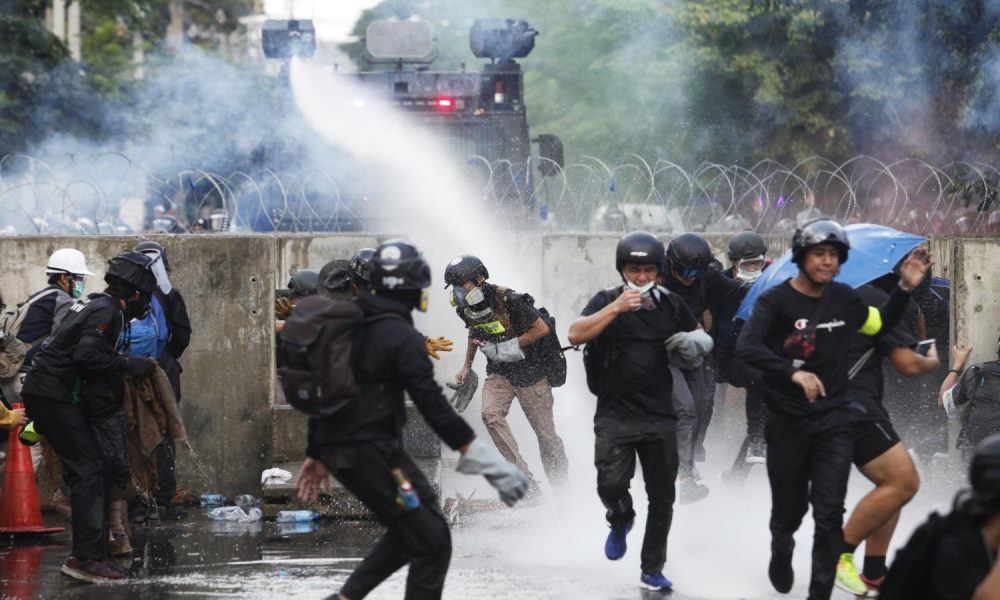 Thai Police and Anti-Government Protesters Clash Outside of Parliament