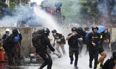 Thai Police and Anti-Government Protesters Clash Outside of Parliament