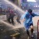 Anti-Government Protesters Defy Police Water Cannons to Deliver Letters