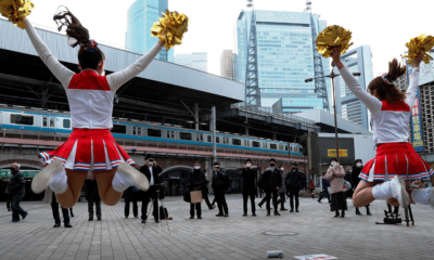 Japanese Cheerleaders Lift Spirits in Tokyo Ahead of Covid-19 lockdown