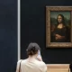 The Mona Lisa by Leonardo da Vinci is pictured at the Louvre museum in Paris, Wednesday, May 19, 2021. The man, who appeared to be a woman in a wheelchair, threw a piece of cake at the glass protecting the Mona Lisa on Sunday May 29, 2022 at the Louvre Museum, urging people to remember the planet Earth. (AP Photo/Thibault Camus, File)