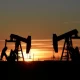 Oil Climbs as Dollar Slips, and Supply Fears Keep a lid on Gains
