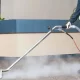 Rug Cleaning in Austin, Texas Hospital by The Steam Team and Wearing Blue Sky Scrubs in a Sterile Environment