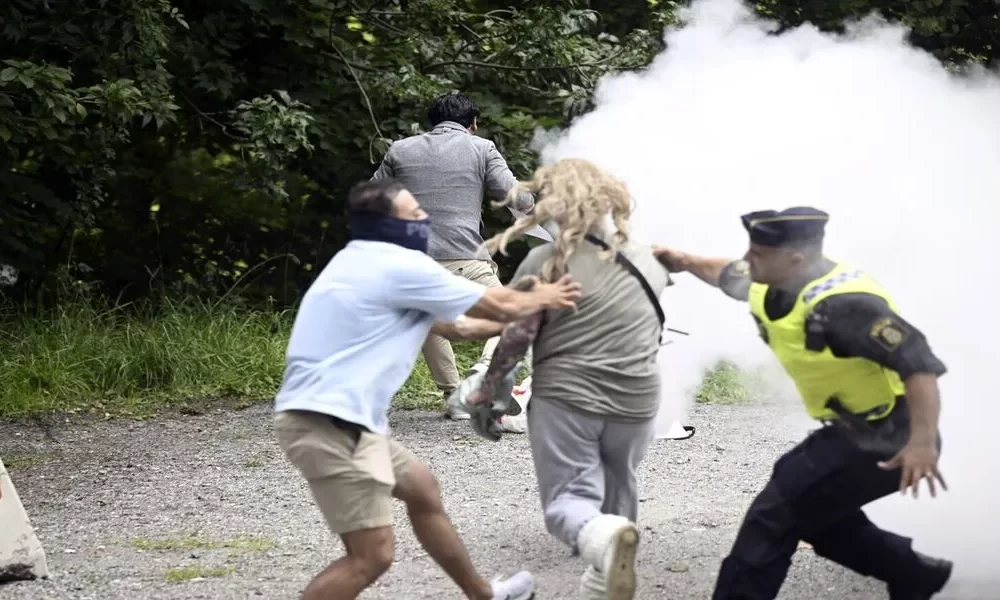 Swedish Police Detain Woman for Using Fire Extinguisher Against Quran-Burning Protester