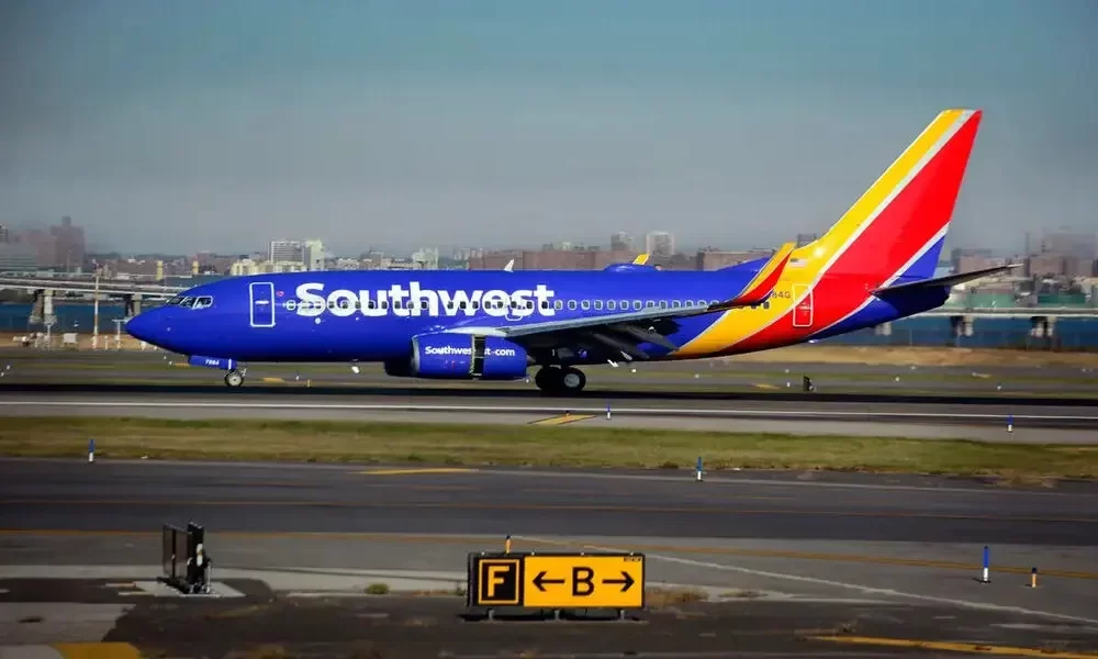 Southwest Airlines Passenger Hospitalized For Opening Emergency Exit And Climbing Onto Wing.