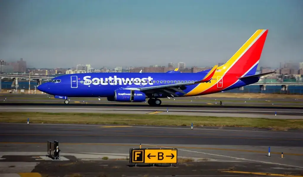 Southwest Airlines Passenger Hospitalized For Opening Emergency Exit And Climbing Onto Wing.